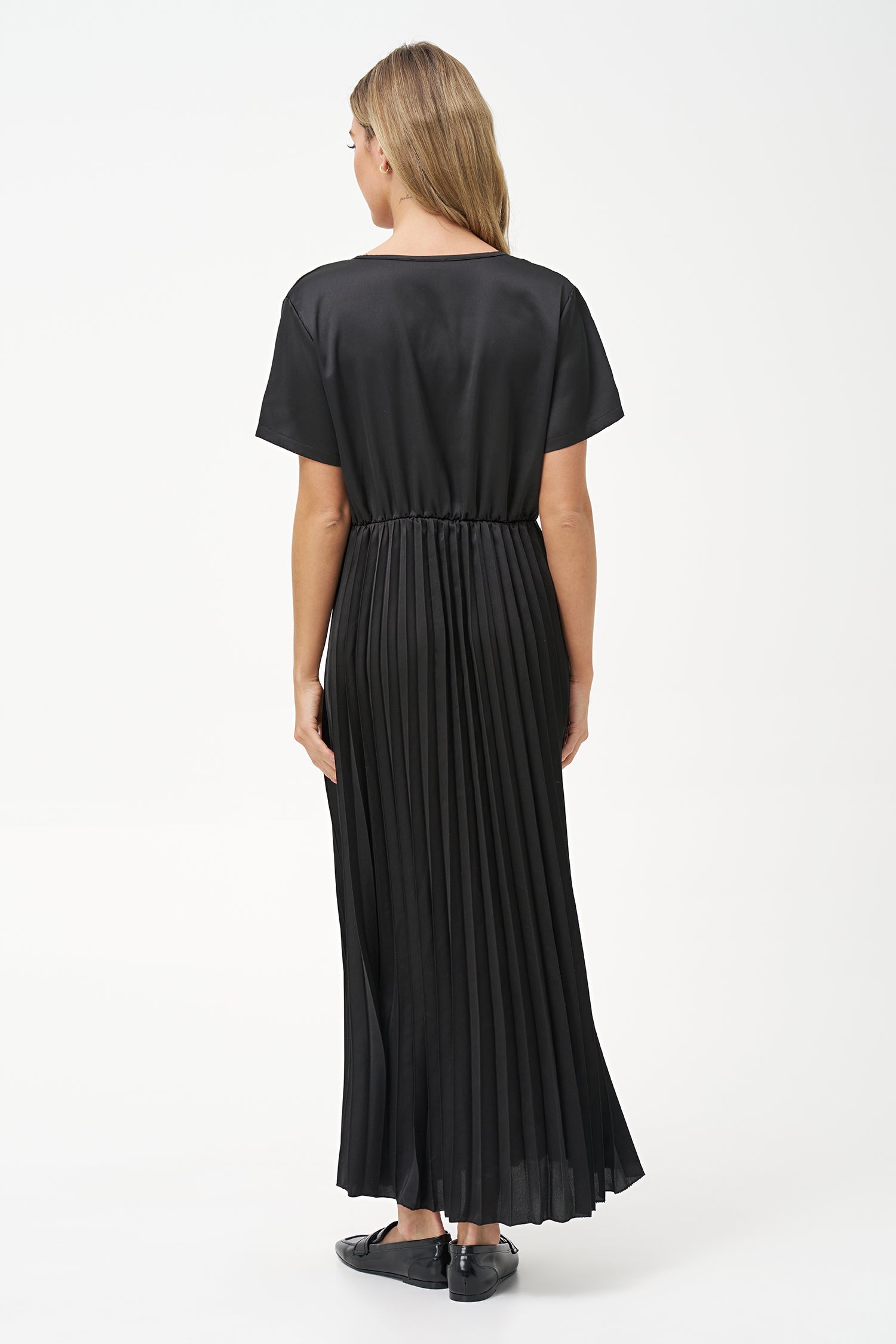 Women’s woven v-neckline short sleeve dress. a plain top half with a pleated bottom half