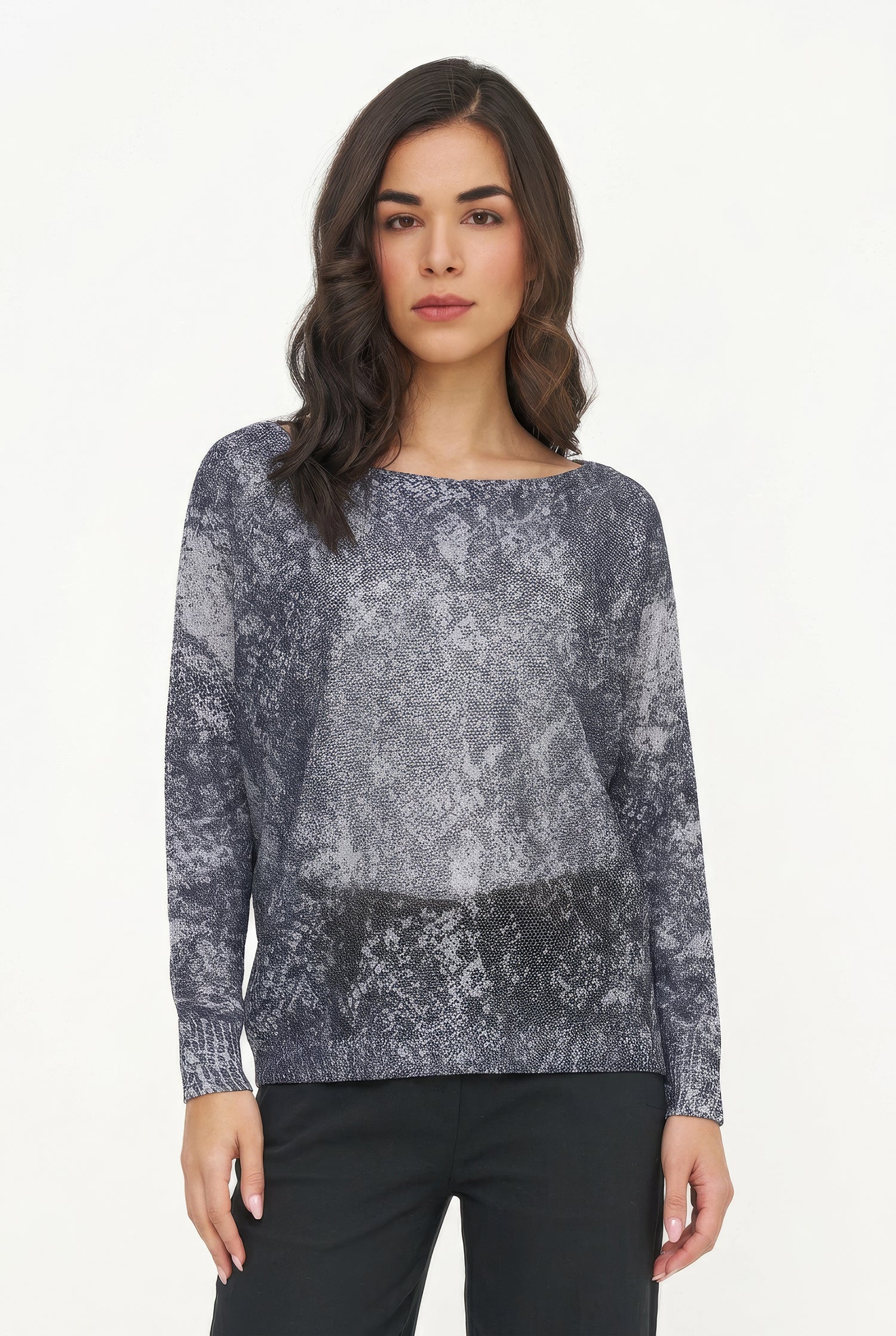Woman wearing a patterned gray sweater on a white background