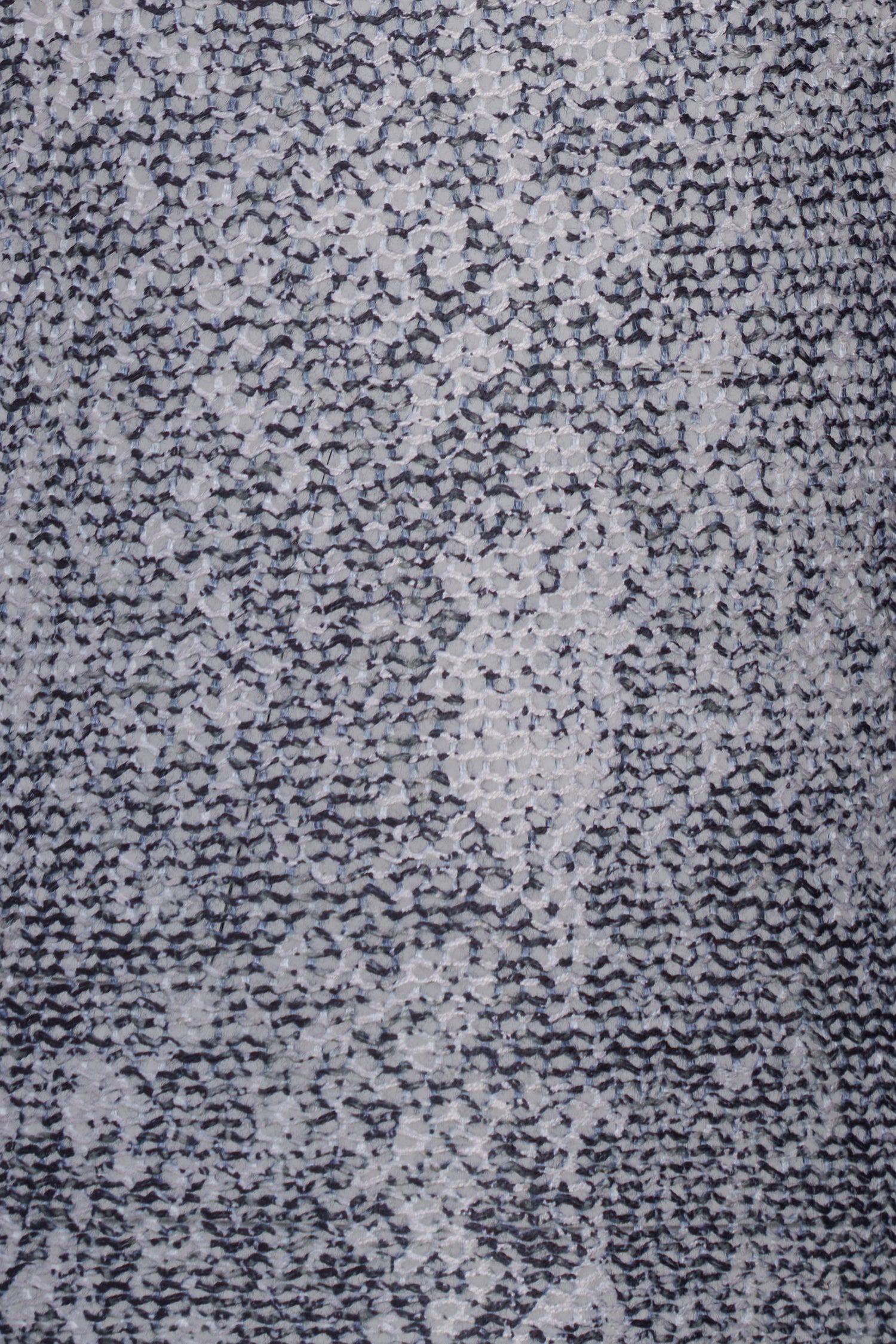 Close-up of a textured gray fabric with a subtle pattern