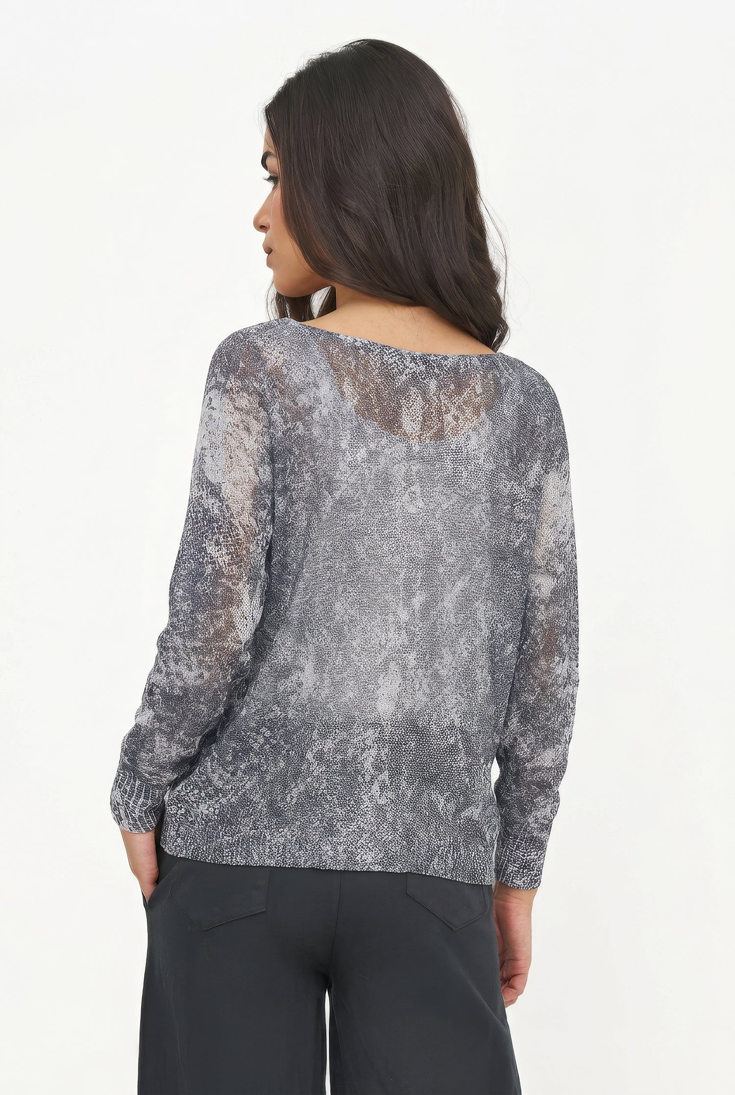 Woman wearing a gray patterned top with lace details on a white background