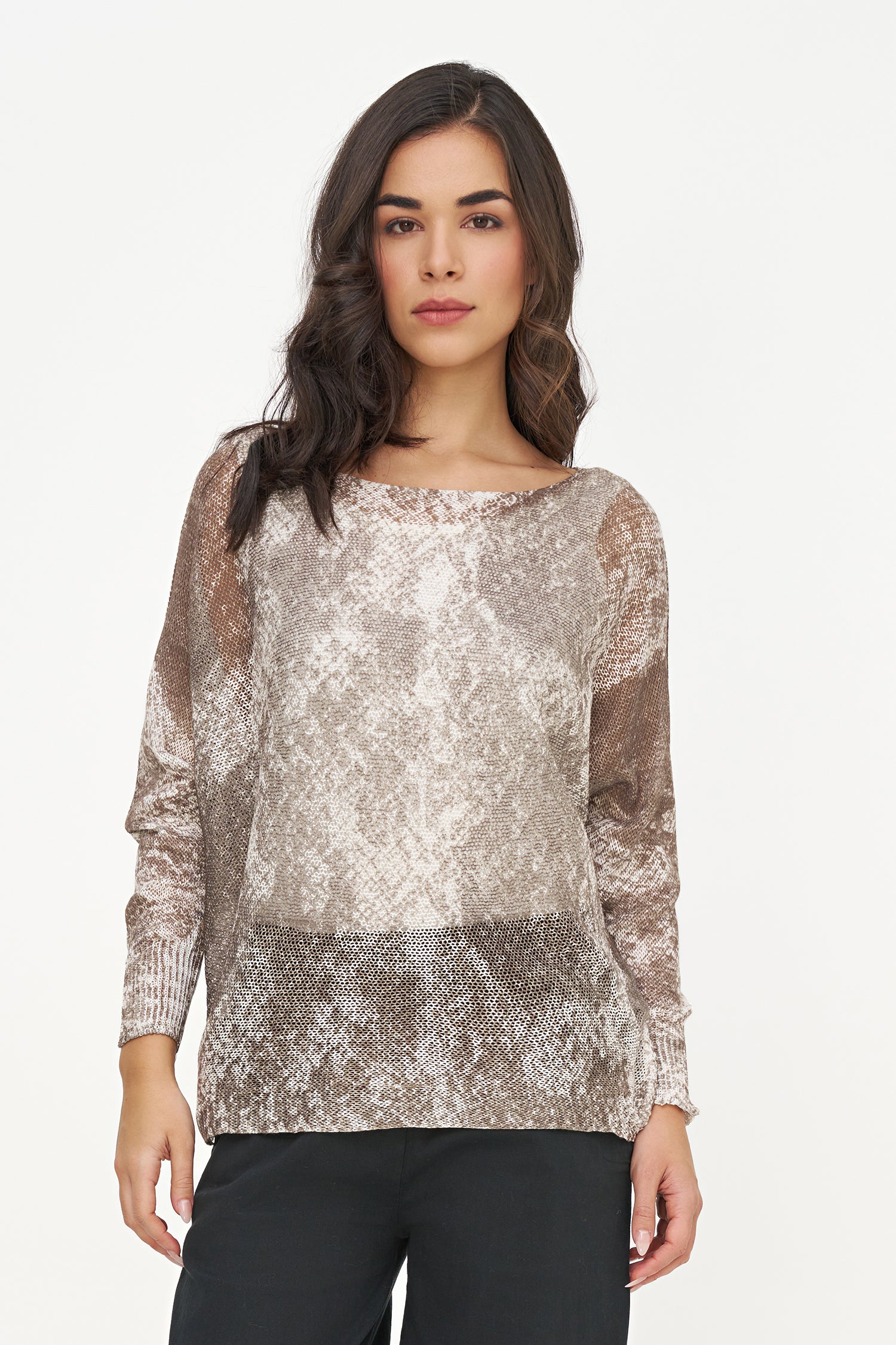 Woman wearing a patterned top on a white background
