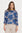 Woman wearing a blue and beige patterned top on a white background