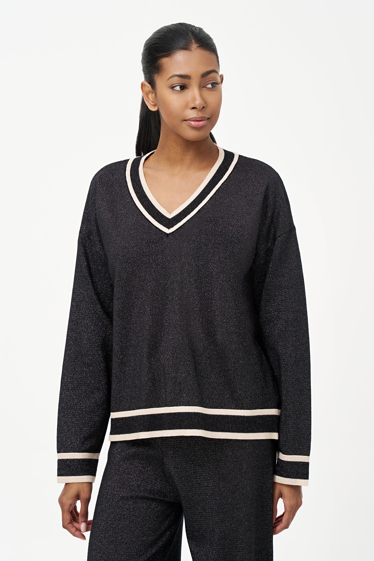 Women's knit v-neck sweater with a patch pocket at the chest and long sleeves