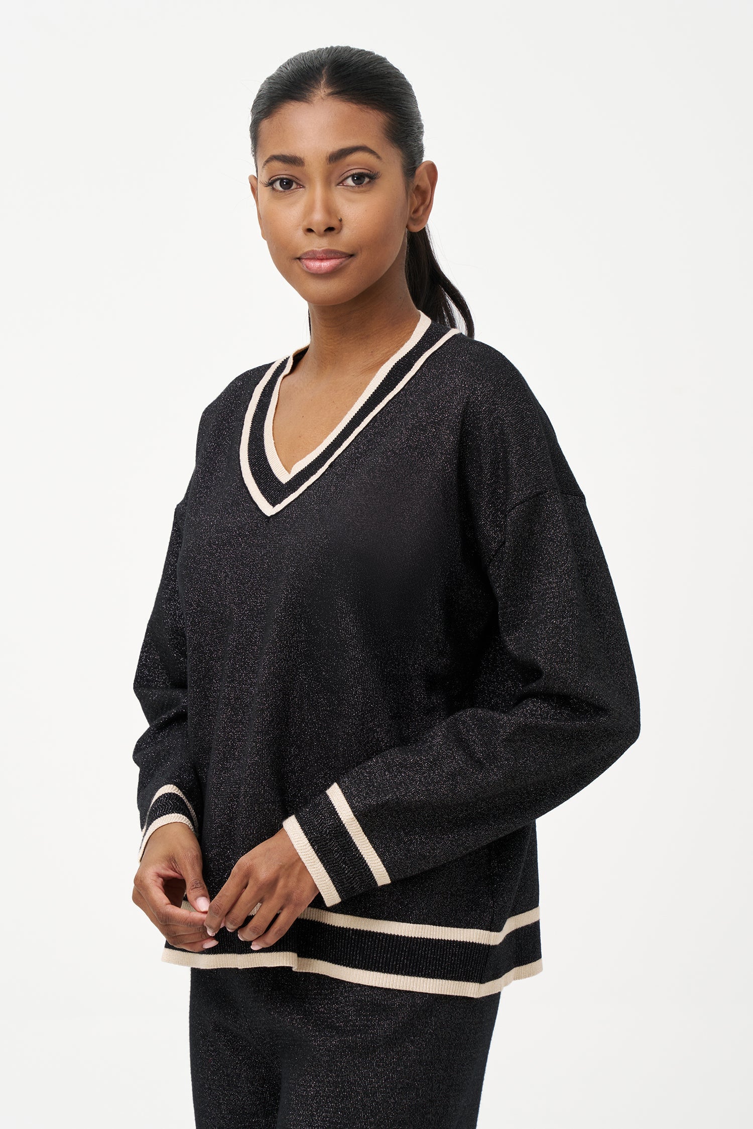 Women's knit v-neck sweater with a patch pocket at the chest and long sleeves