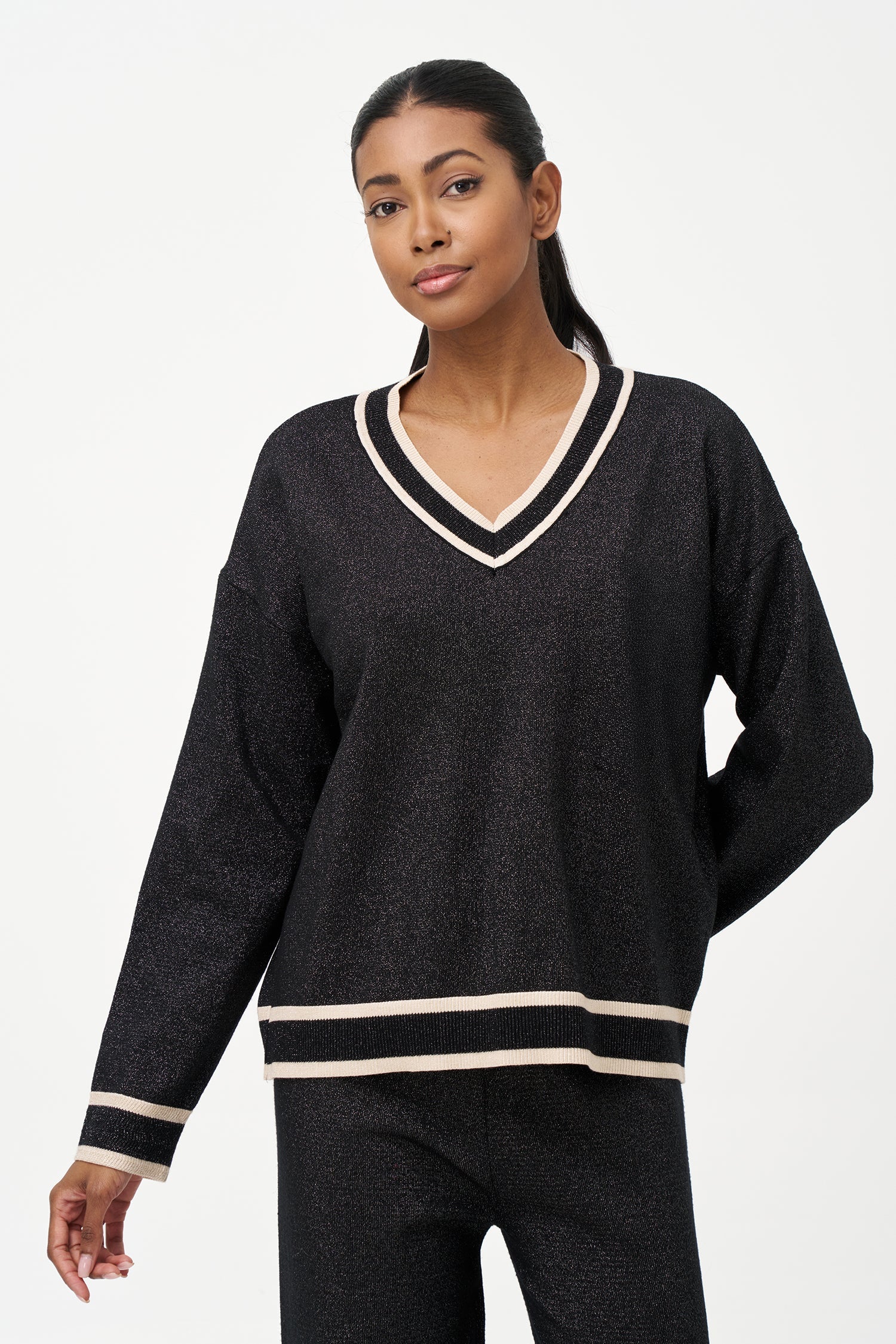 Women's knit v-neck sweater with a patch pocket at the chest and long sleeves