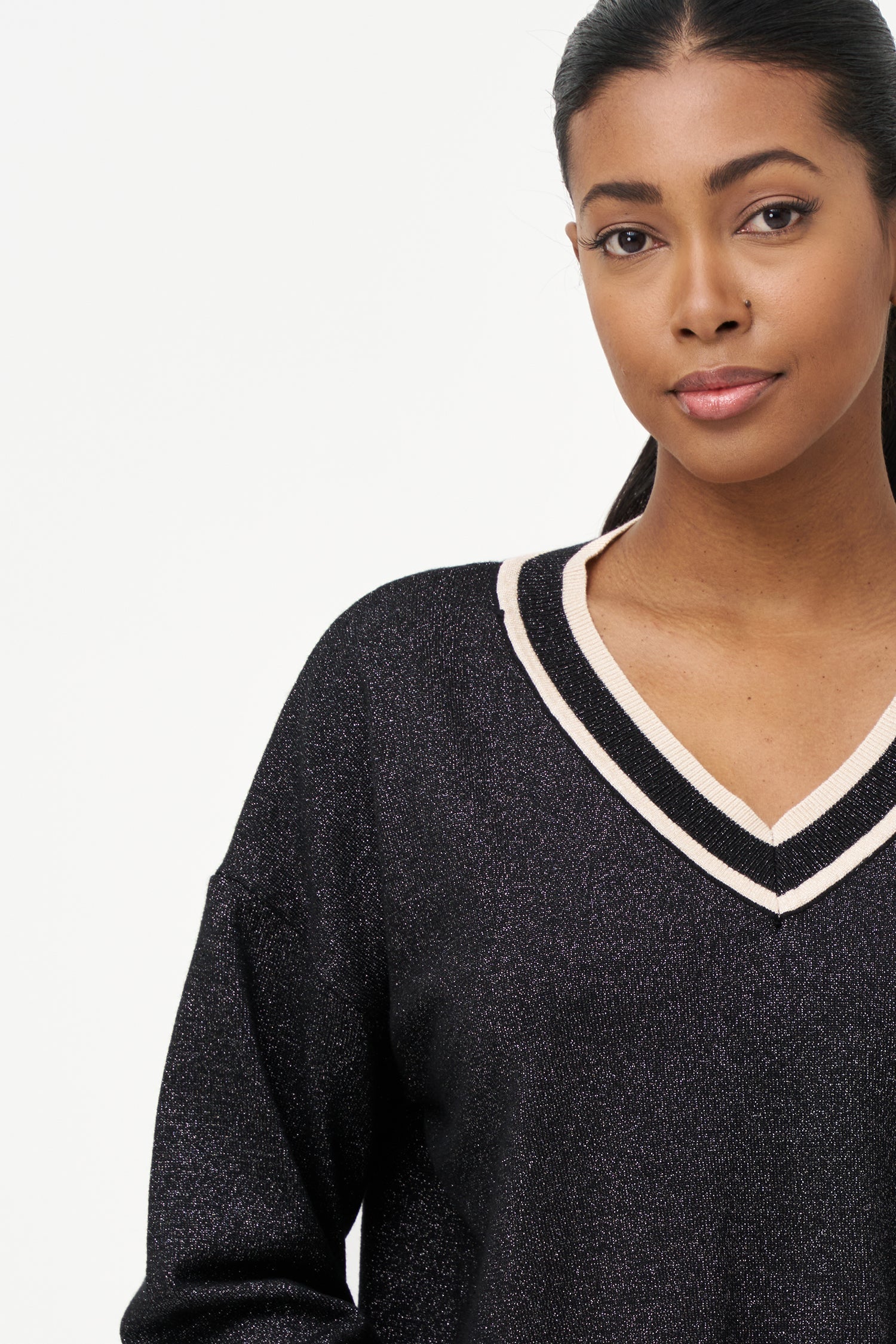 Women's knit v-neck sweater with a patch pocket at the chest and long sleeves