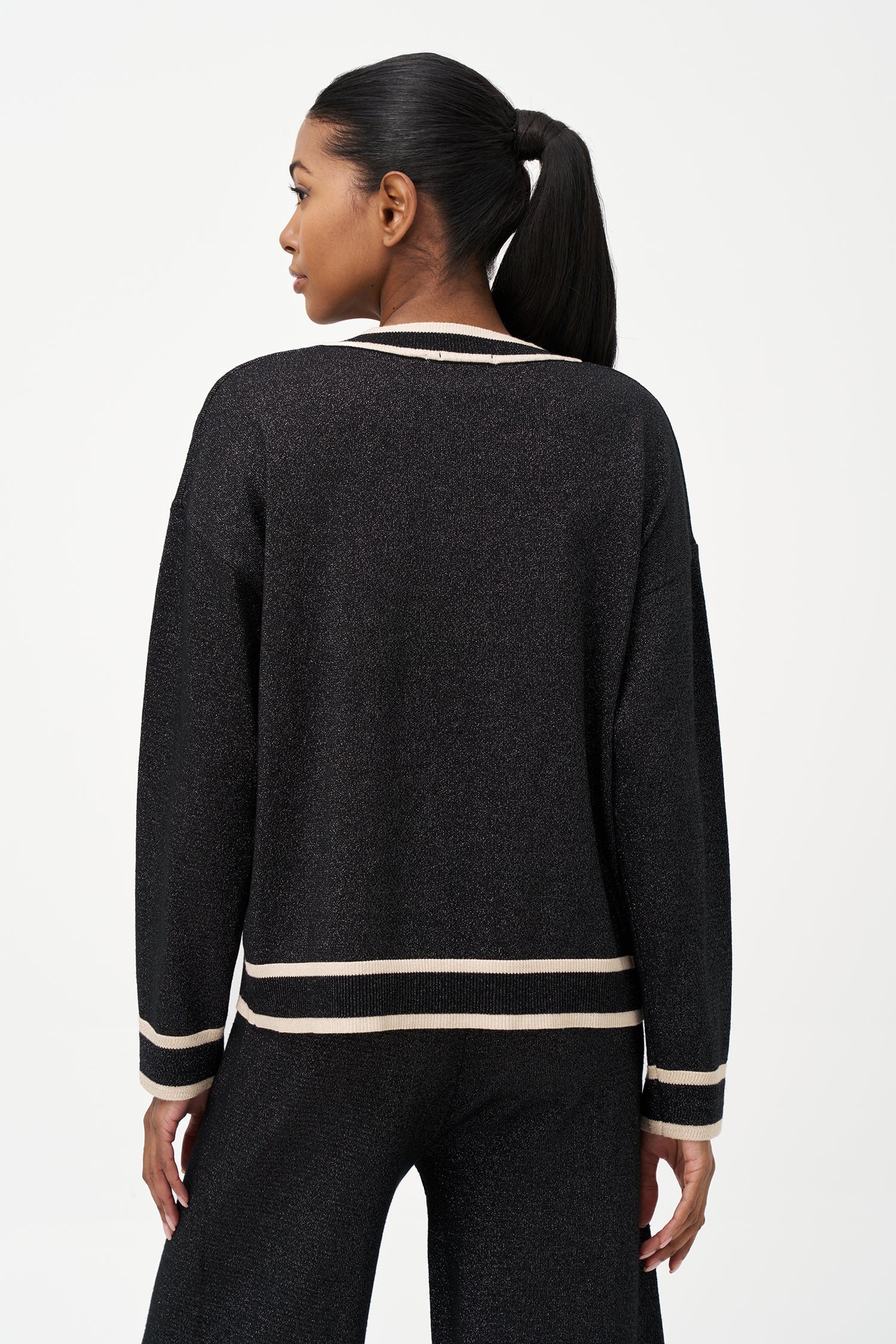 Women's knit v-neck sweater with a patch pocket at the chest and long sleeves
