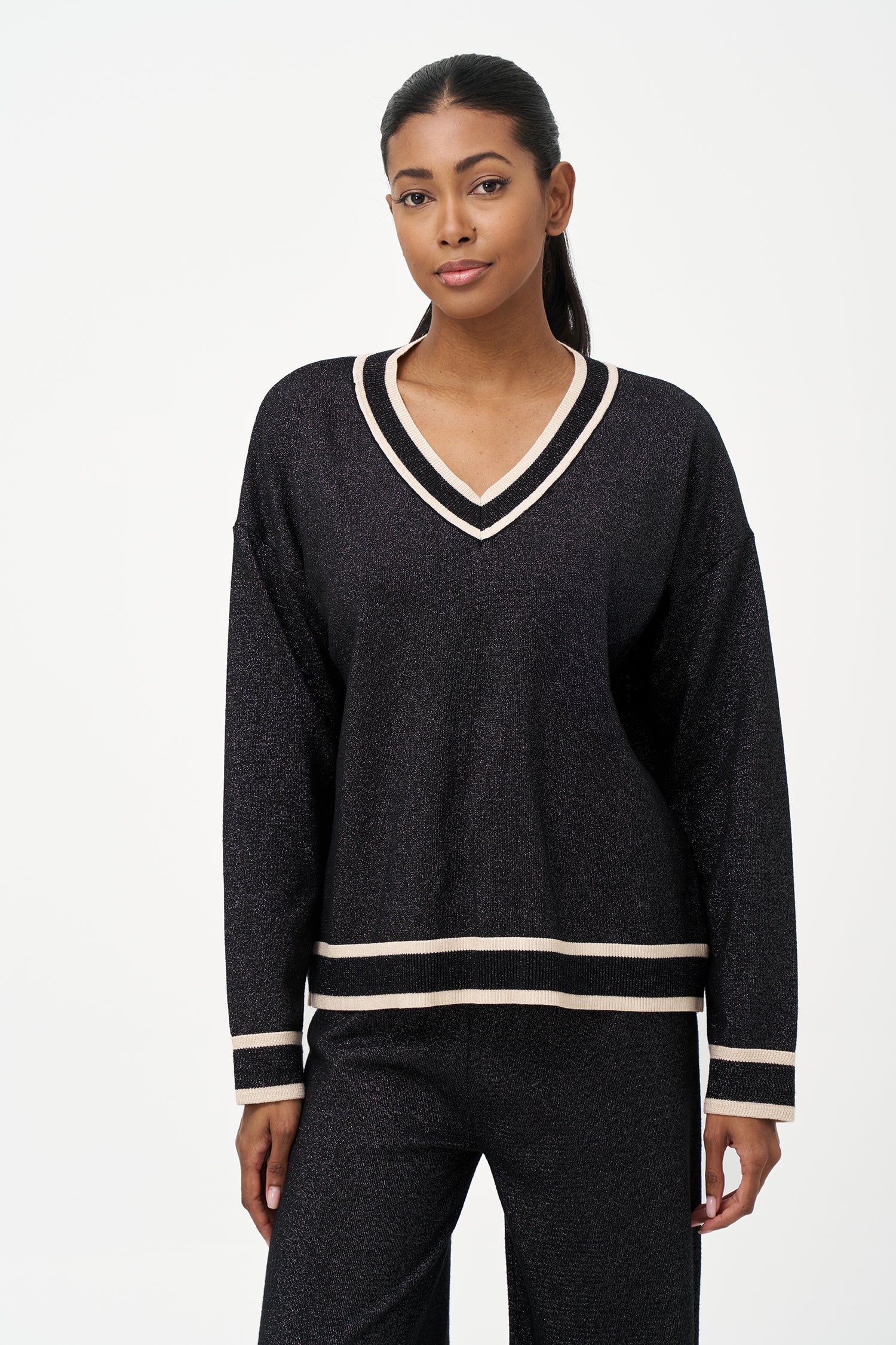 Women's knit v-neck sweater with a patch pocket at the chest and long sleeves