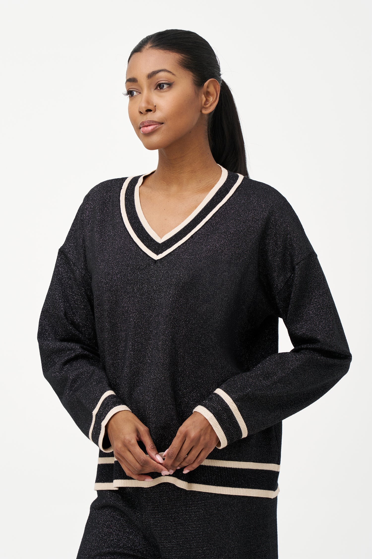 Women's knit v-neck sweater with a patch pocket at the chest and long sleeves