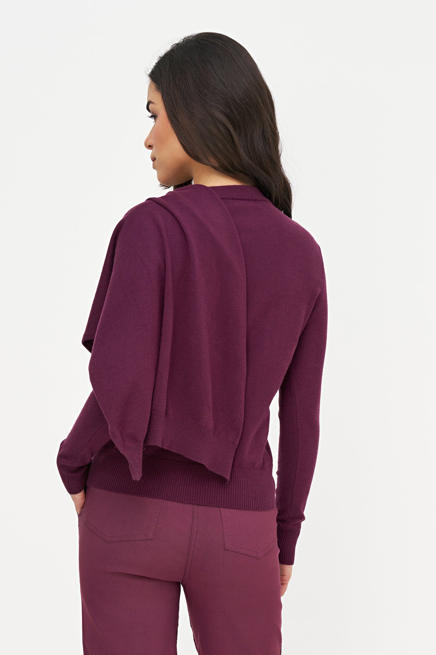 Woman wearing a purple outfit on a white background