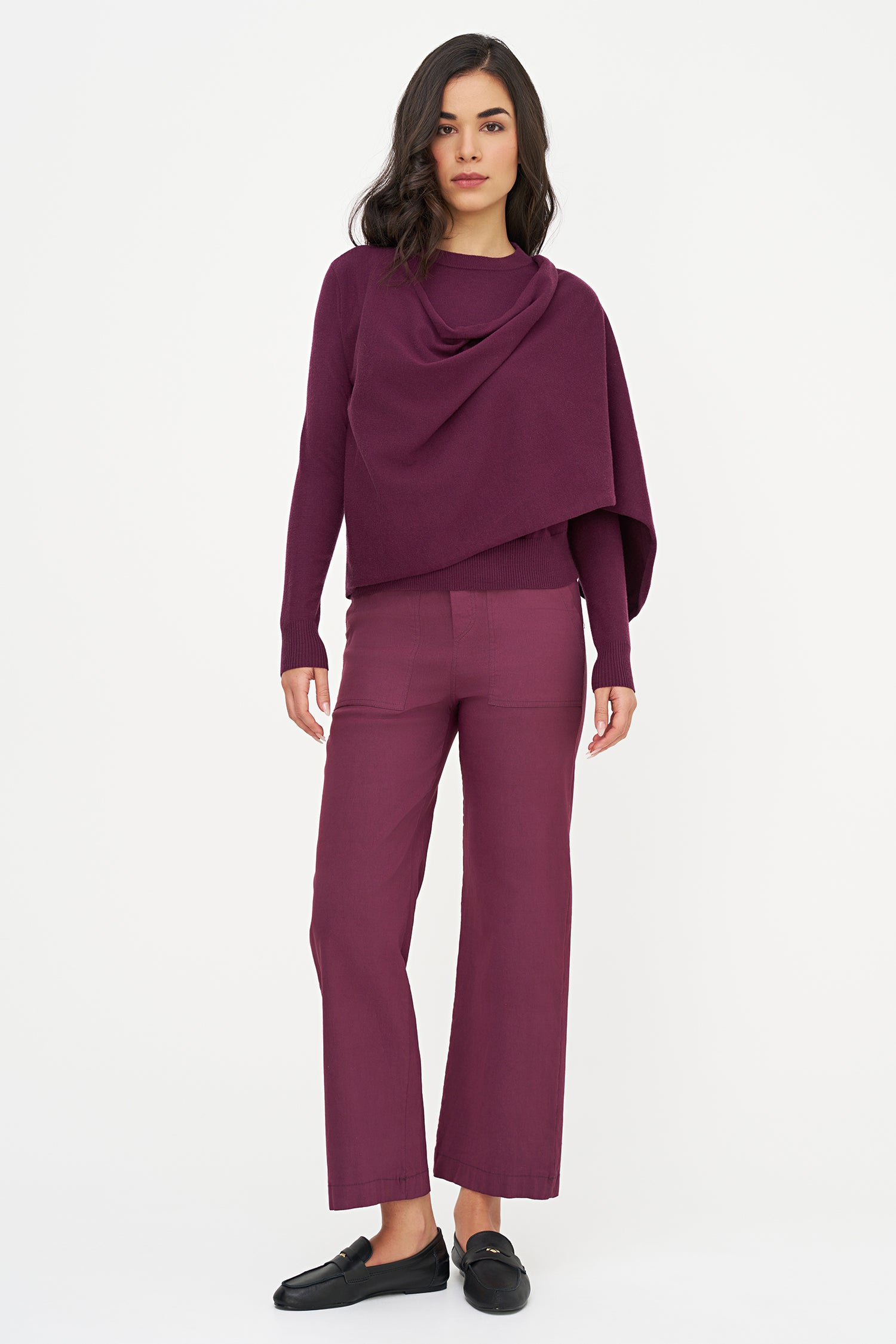 Woman wearing a purple outfit on a white background