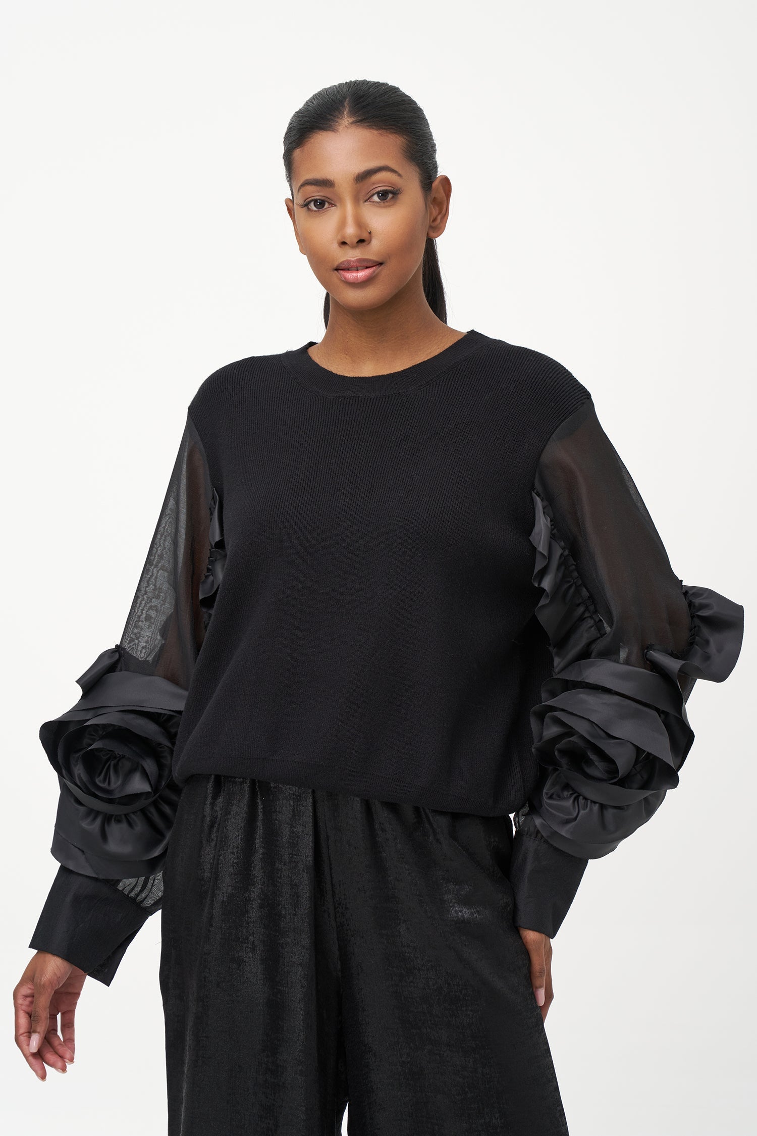 Women’s knit sweater, with sheer sleeves and floral detail