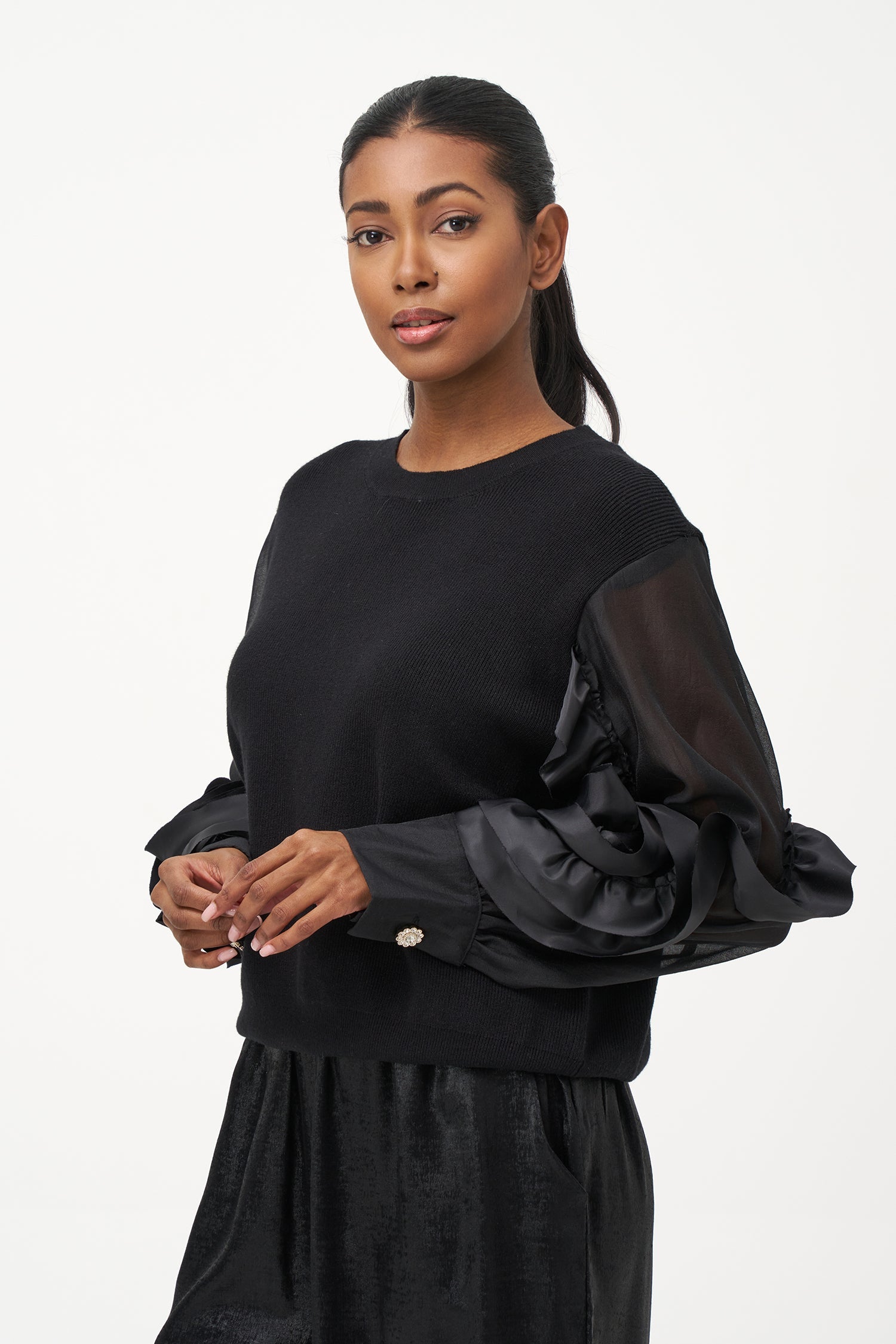 Women’s knit sweater, with sheer sleeves and floral detail