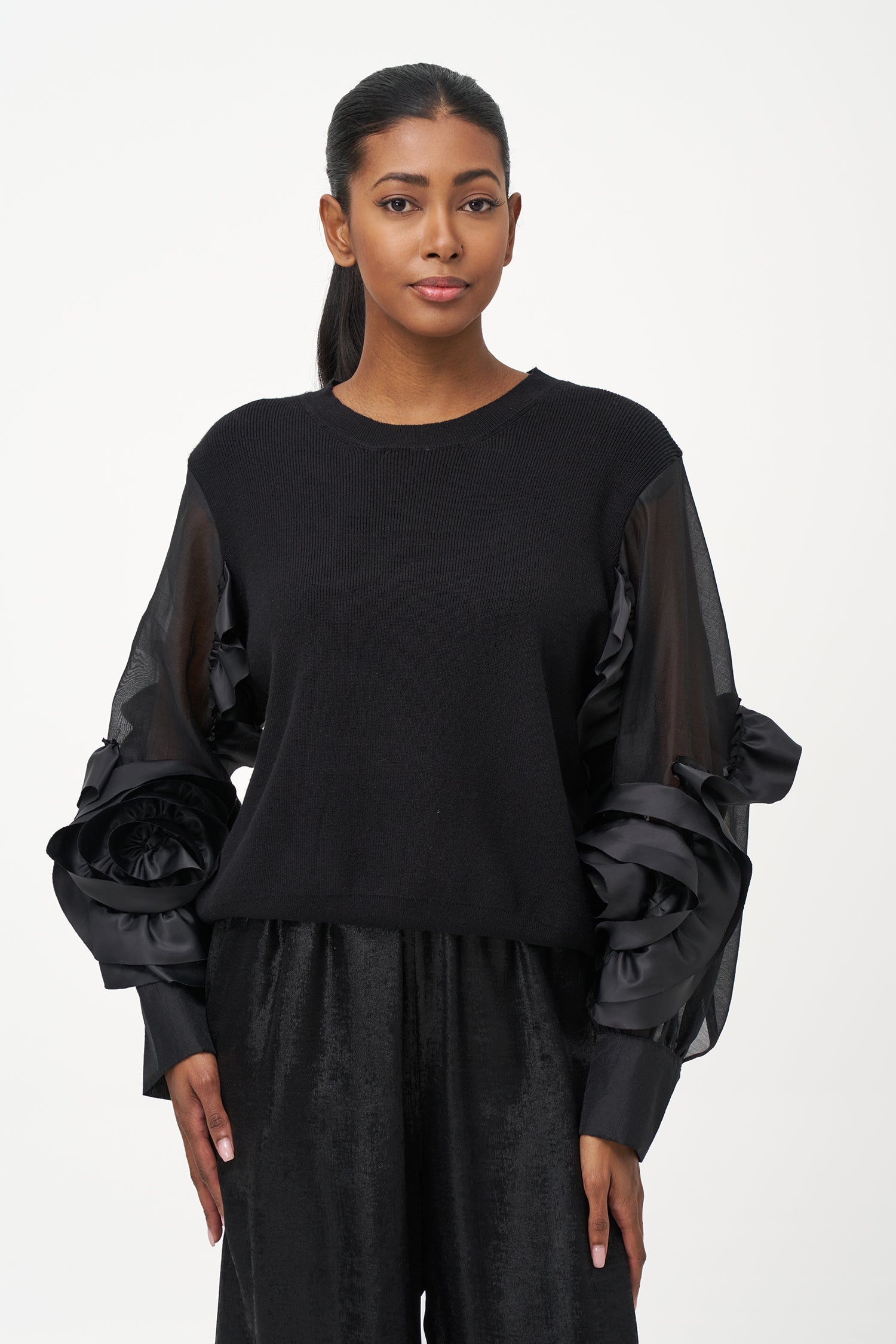 Women’s knit sweater, with sheer sleeves and floral detail