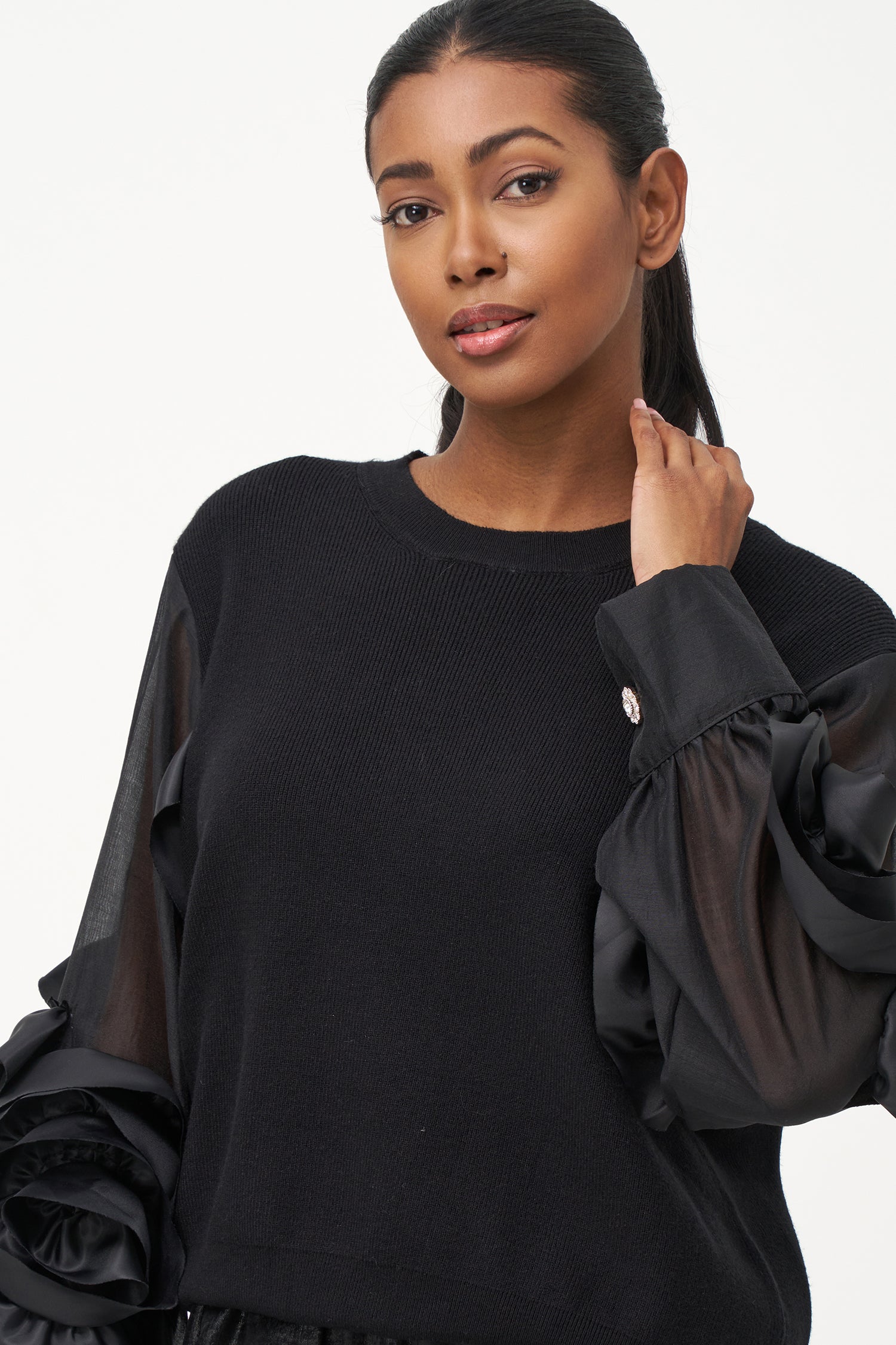Women’s knit sweater, with sheer sleeves and floral detail