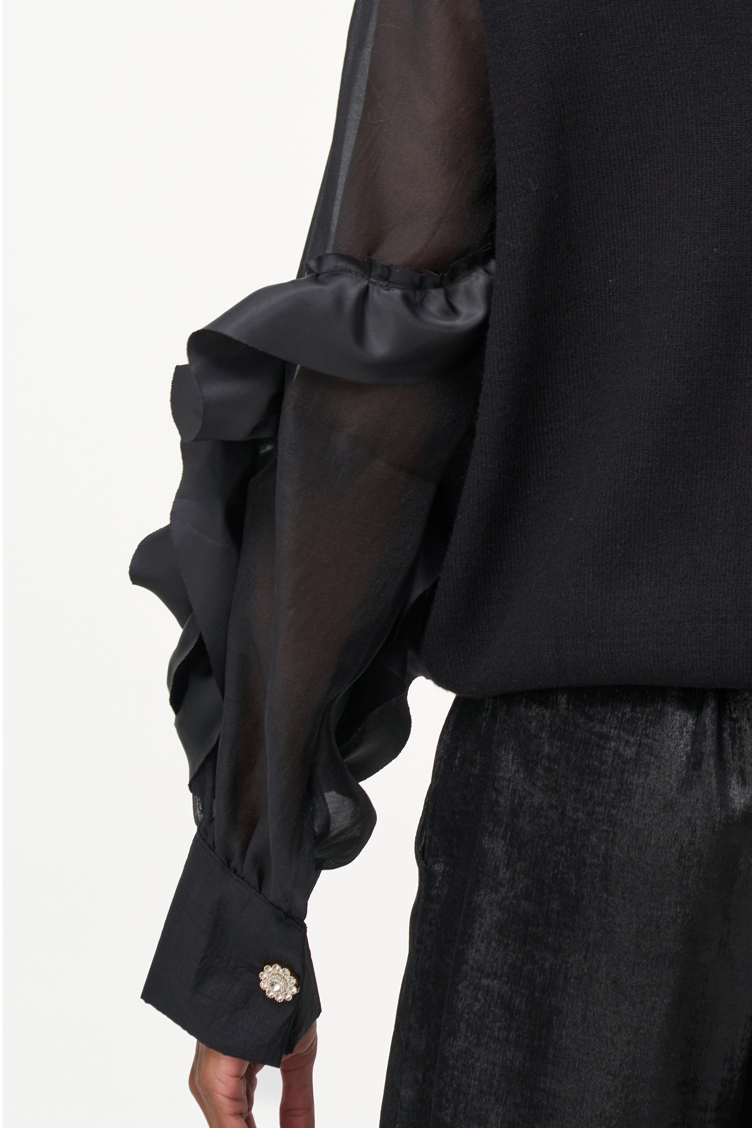 Women’s knit sweater, with sheer sleeves and floral detail