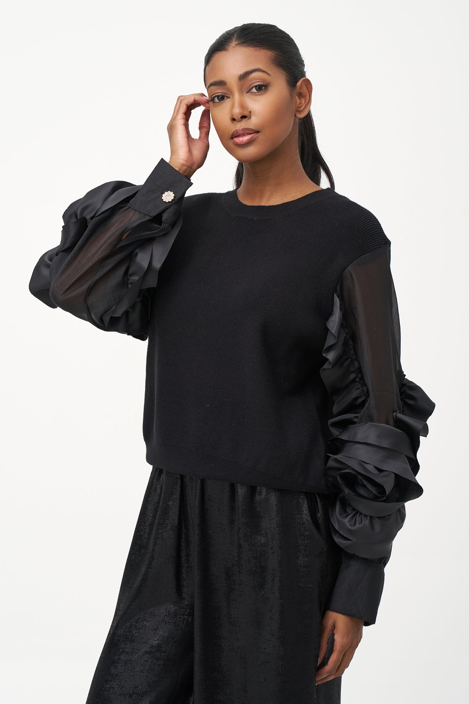 Women’s knit sweater, with sheer sleeves and floral detail
