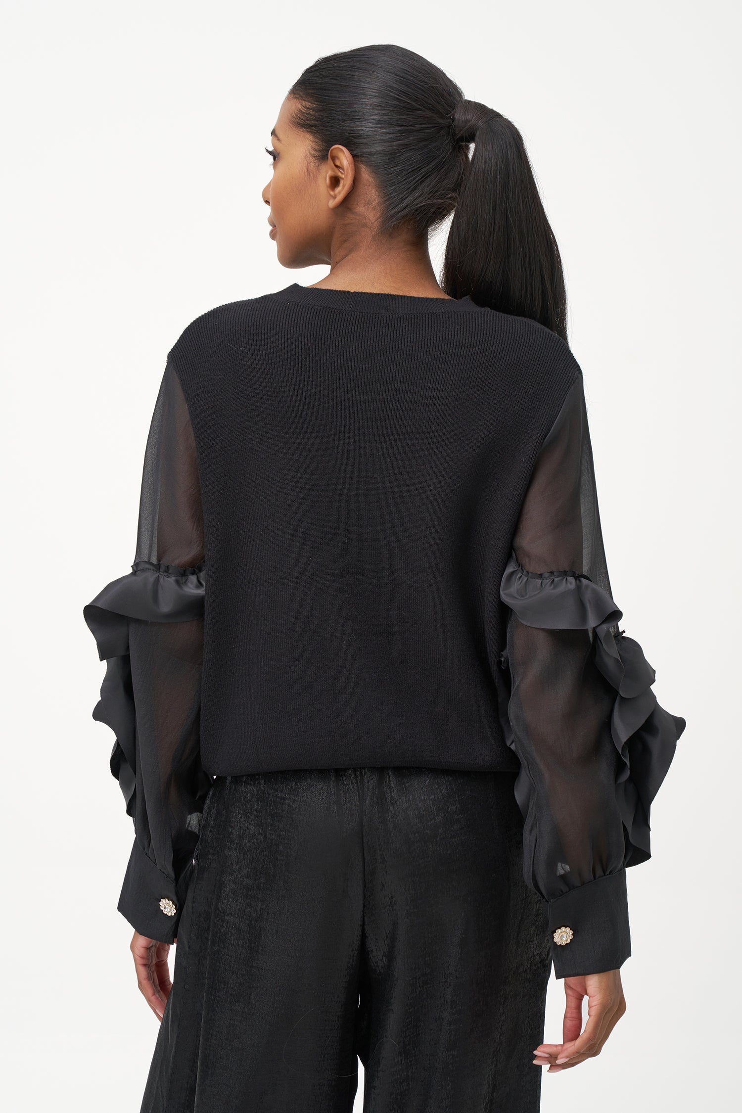 Women’s knit sweater, with sheer sleeves and floral detail