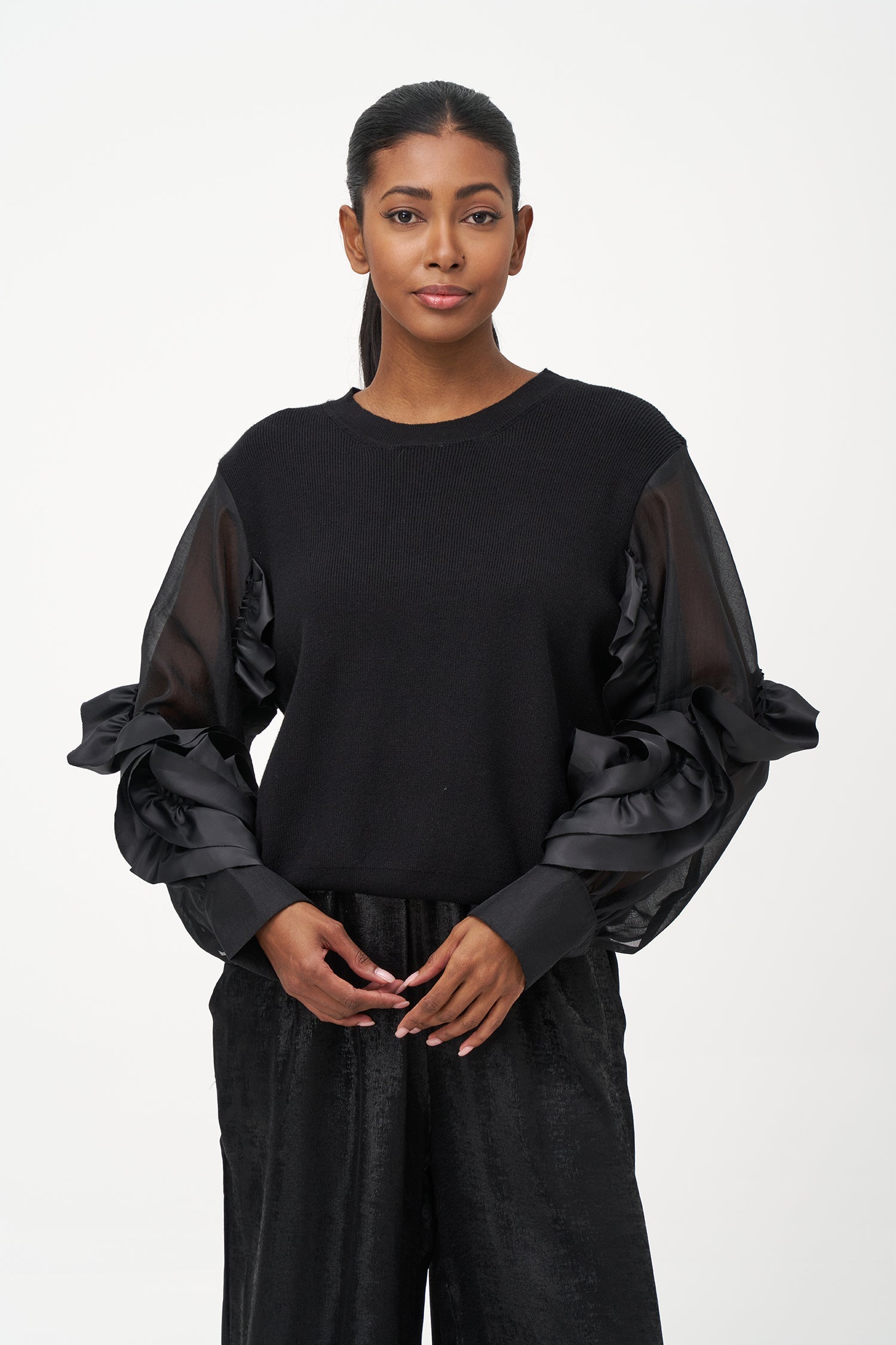 Women’s knit sweater, with sheer sleeves and floral detail
