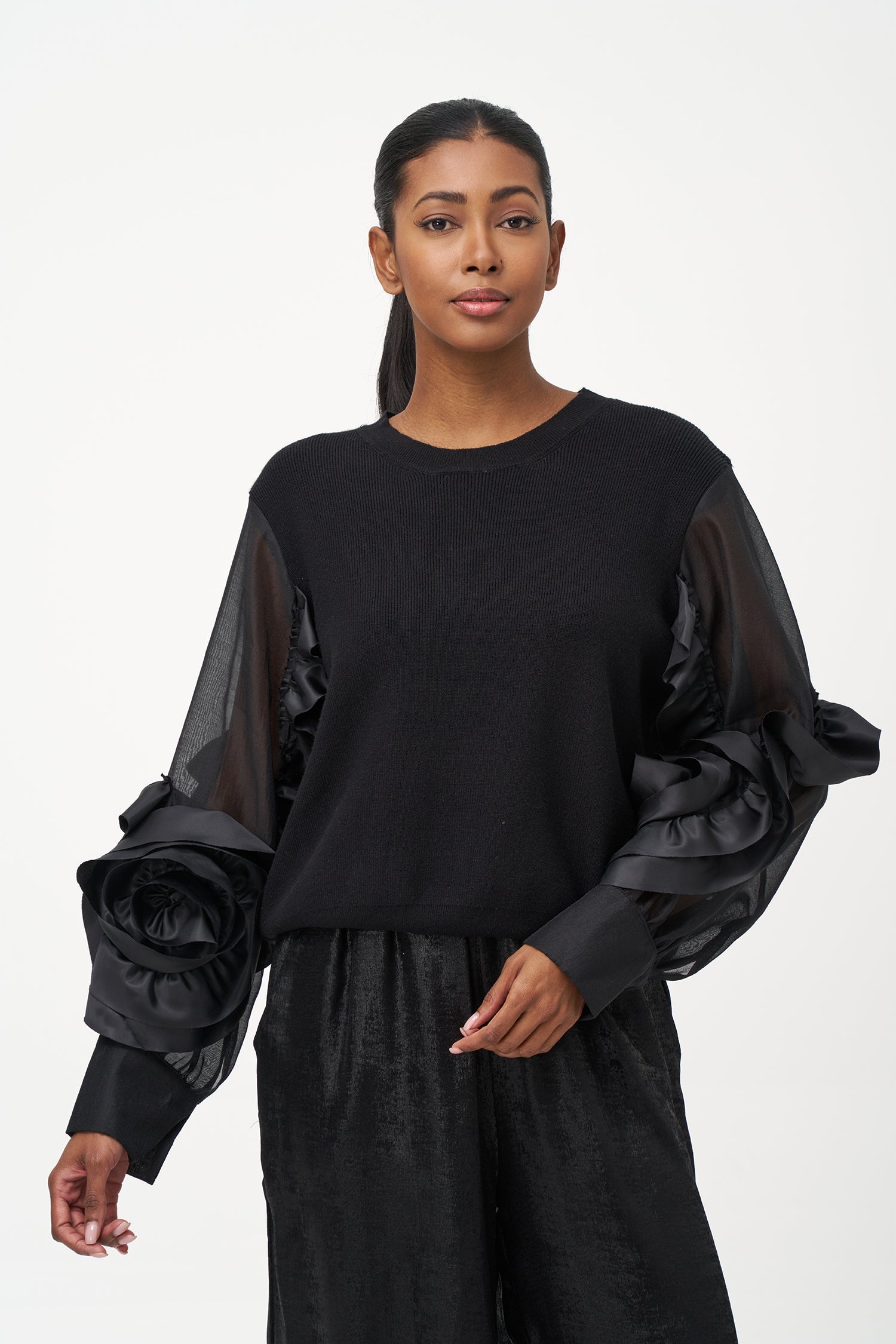 Women’s knit sweater, with sheer sleeves and floral detail